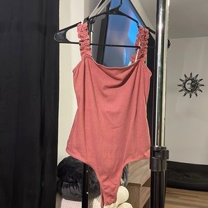 Pink XS bodysuit with ruffle straps
